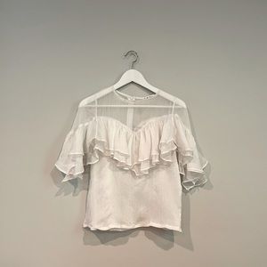White ruffle blouse
